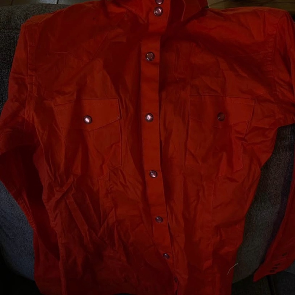 Woman’s PanhandleOrange button down shirt